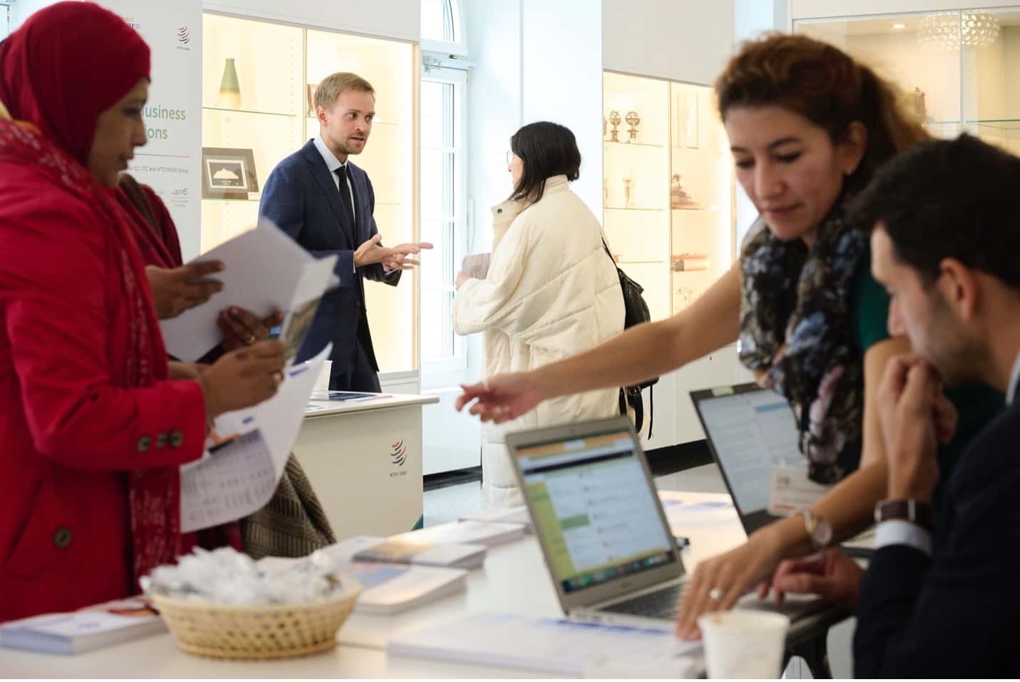 Three individuals learning about new ServiceNow services offered.