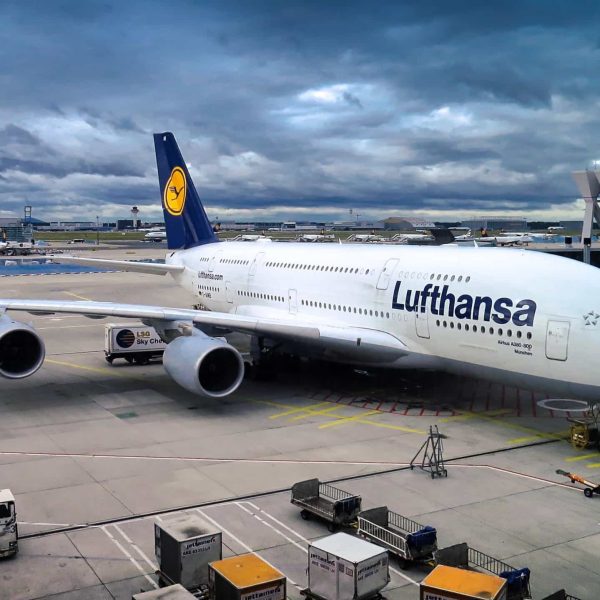 Lufthansa flight parked at gate. 