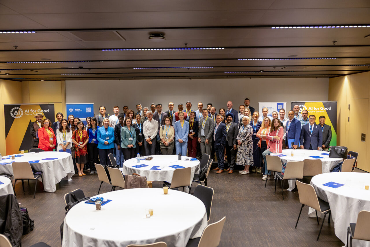 A large group photo of participants at the AI Hub Launch event during the AI for Good Global Summit.