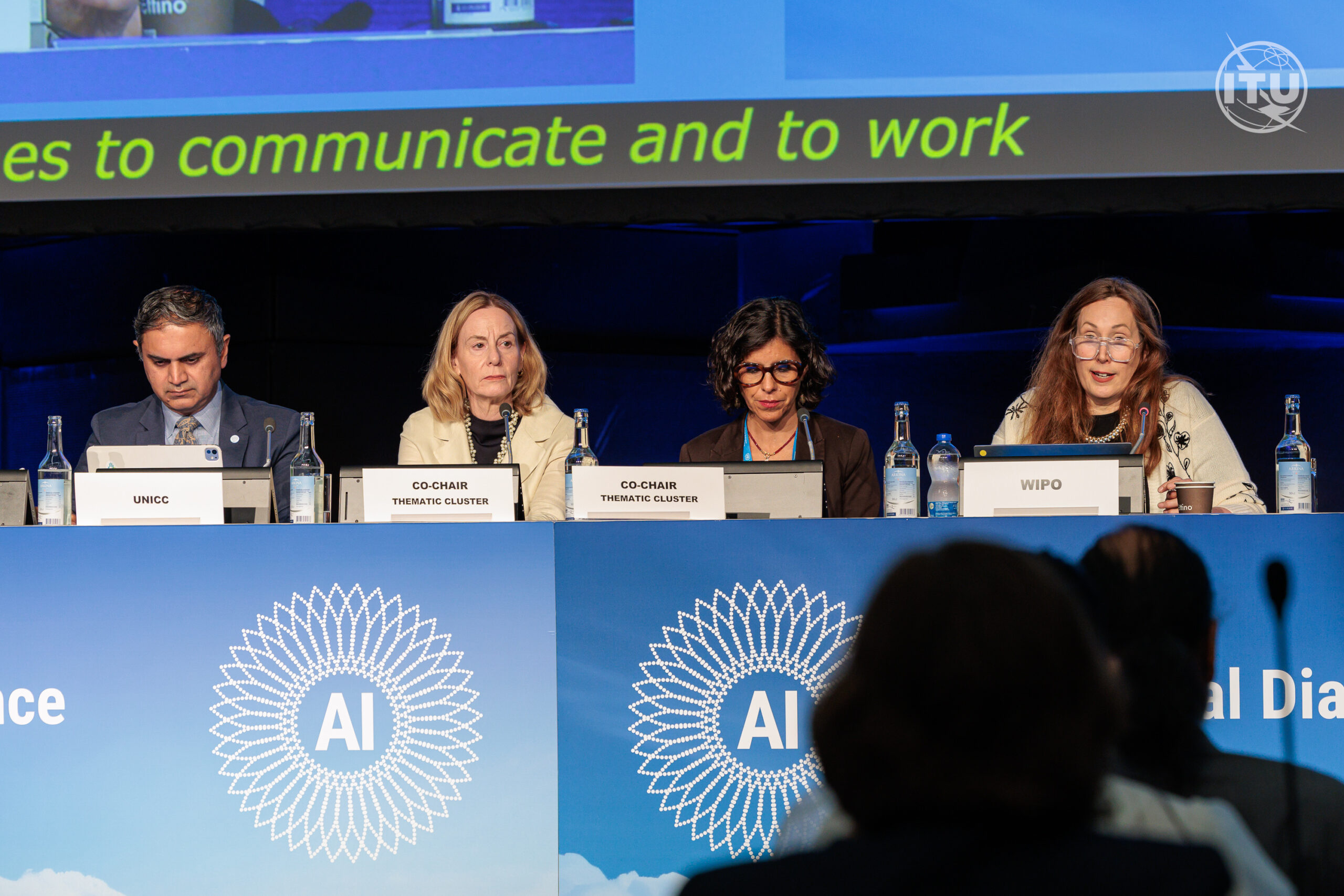 Panelists speak during a thematic discussion on safe, secure, and trustworthy AI at the inaugural Global Dialogue on AI Governance in Geneva, with attendees seated in the foreground.