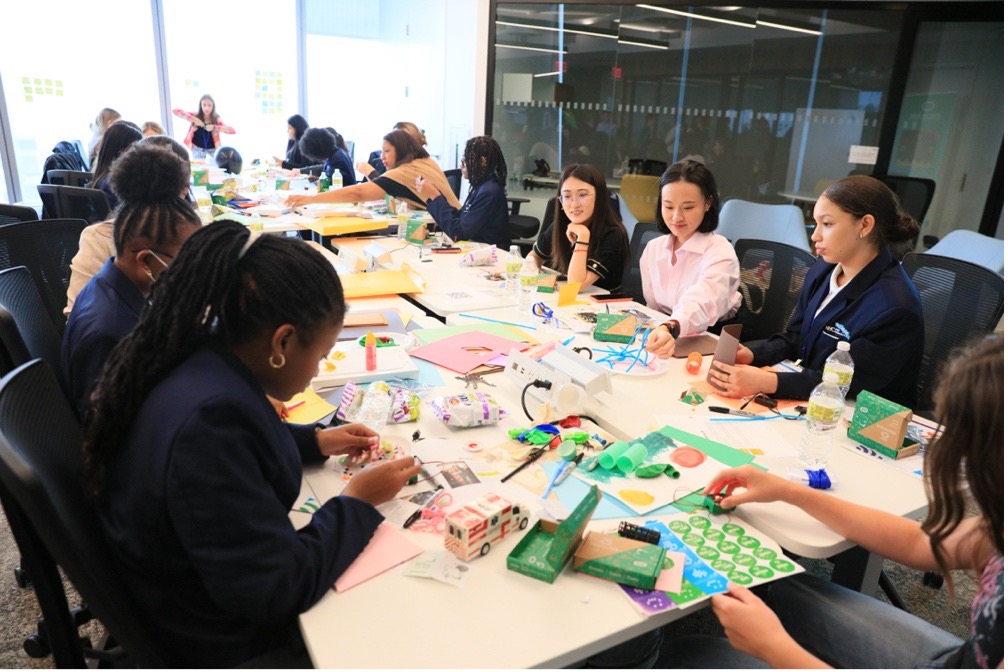 Group engaging in dialogue and performing activity at International Day of the Girl 2022.